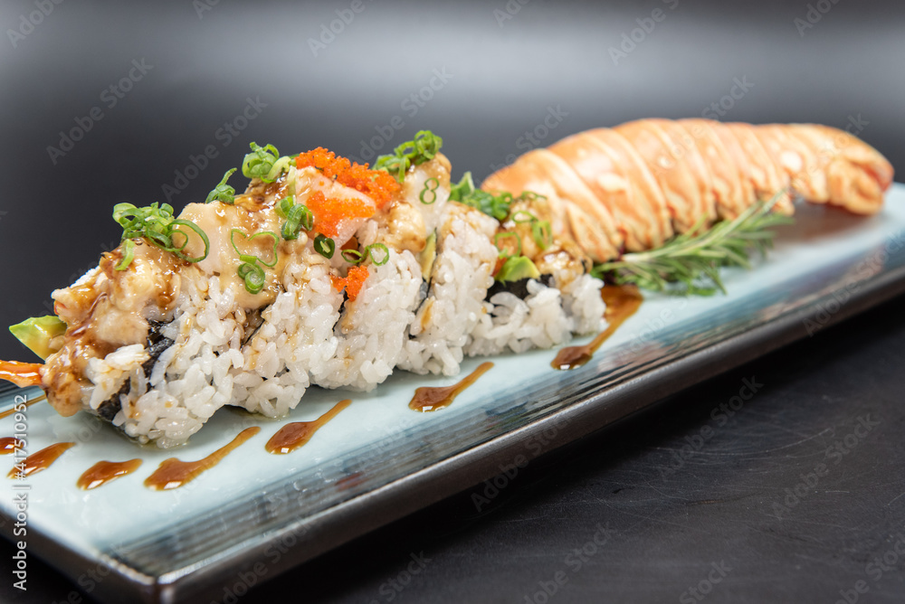 Lobster sushi roll with beautiful presentation on the plate including the shell. Lobster sushi roll with beautiful presentation on the plate including the shell.