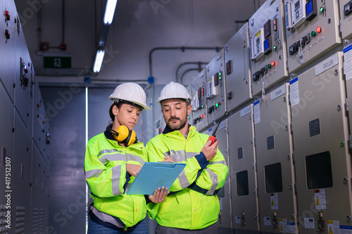 Photography Engineer checking and inspecting at MDB panel , working with electric switchboard to check  medium Voltage Switchgear working in Main Distribution Boards factory