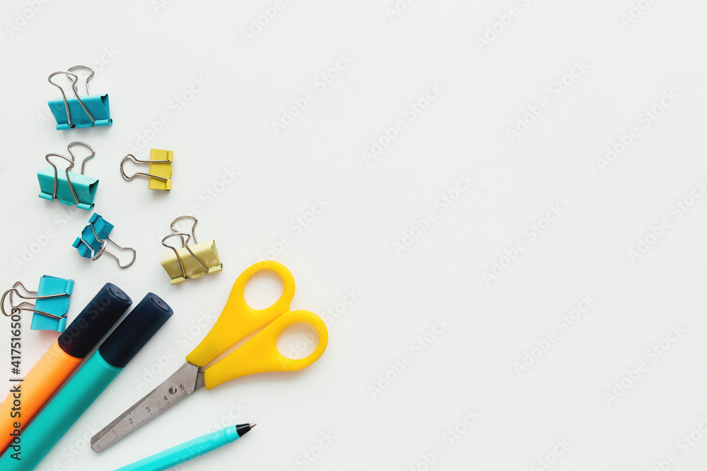 Clips, pencil, marker, scissors, white background. Work and education concept Clips, pencil, marker, scissors, white background. Work and education concept
