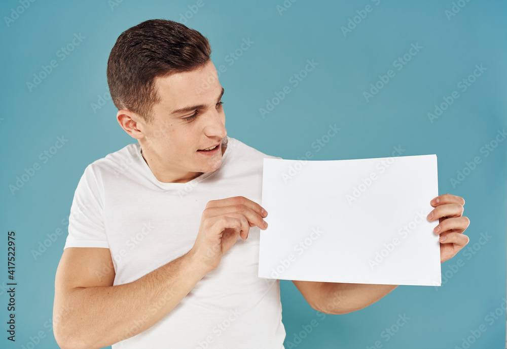 Guy with a white sheet of paper blue background advertising mocap poster Guy with a white sheet of paper blue background advertising mocap poster