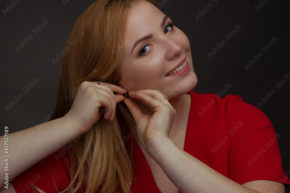 a blonde girl with an overweight plus size, a red overallposing on a dark Studio background a blonde girl with an overweight plus size, a red overallposing on a dark Studio background