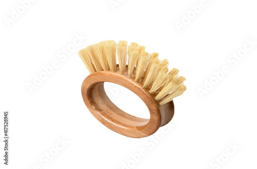 Wooden brush with bamboo wood and natural Bristle Tampico Fiber, background isolated and clipping path.  Item for cleaning in kitchen. photo