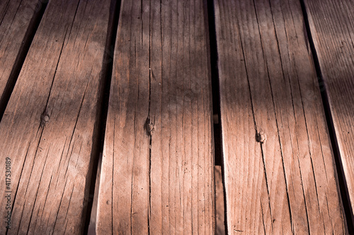 weathered textured dark brown wood background. Texture of brown old wood. Wide burned board texture close-up. a wooden pattern. 