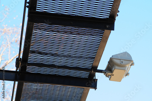 Canvas Print Underside view of a billboard structure showing metal walkway grating and mounte