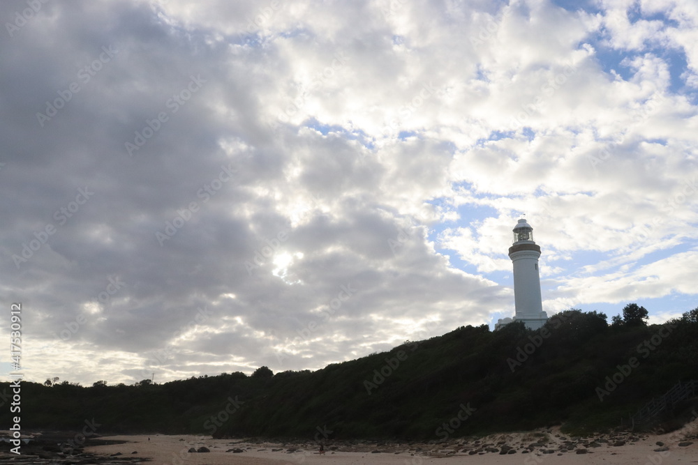 Clouds are turning gray above the Norah Head light house located in the Central Coast of Australia.