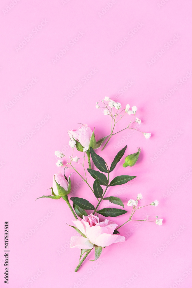 Creative layout made with pink and violet flowers on pink background. Flat lay.