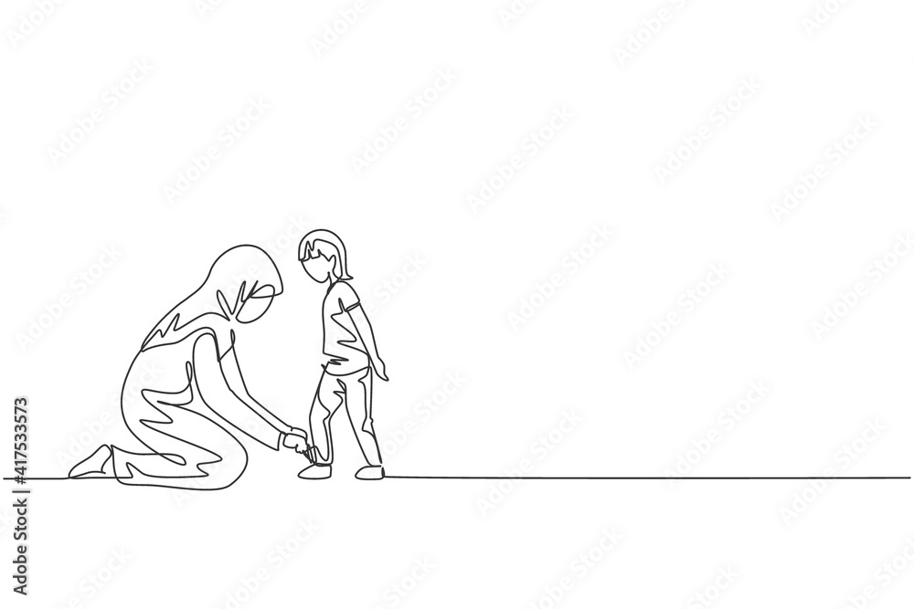 Single continuous line drawing of young Arabian mom help her son to tie shoelace before go to school, happy parenting. Islamic muslim family care concept. One line draw design vector illustration