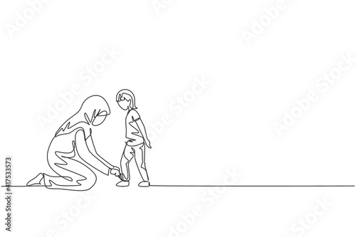 Single continuous line drawing of young Arabian mom help her son to tie shoelace before go to school, happy parenting. Islamic muslim family care concept. One line draw design vector illustration