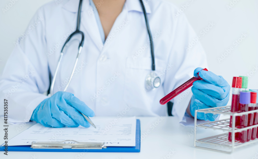 Professional doctors perform tests from samples of blood tests to diagnose virus infections analysis and sampling of infectious diseases, medical concepts, and health care Professional doctors perform tests from samples of blood tests to diagnose virus infections analysis and sampling of infectious diseases, medical concepts, and health care