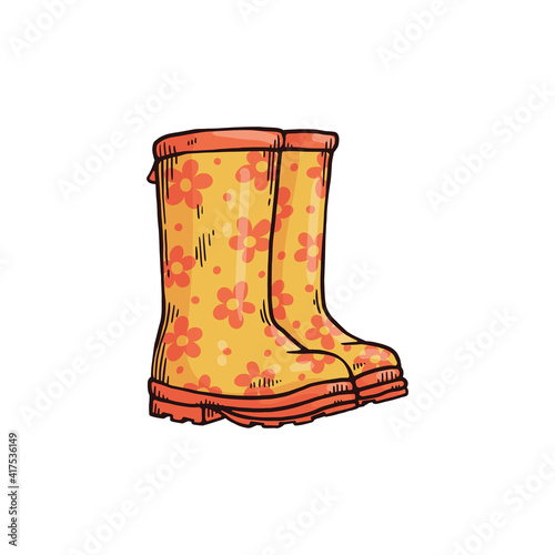 Yellow wellies with flower pattern for rainy weather in autumn or spring season.