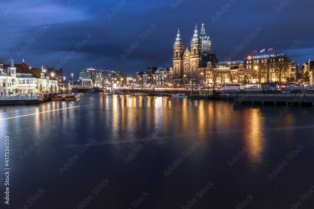 Night cityscape in the Amsterdam harbor in Netherlands