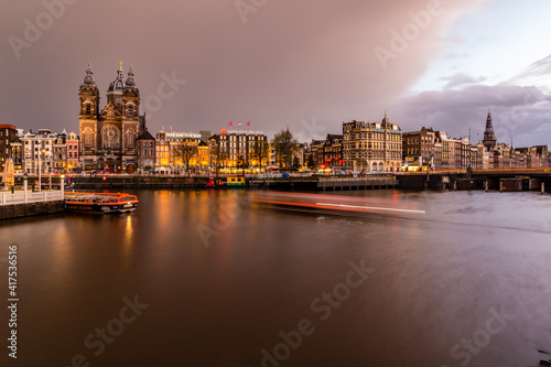Night cityscape in Amsterdam harbor in Netherlands