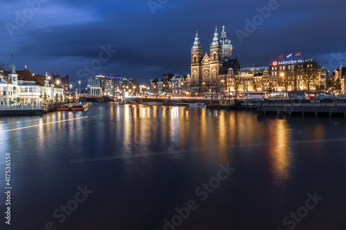 Night cityscape in the Amsterdam harbor in Netherlands