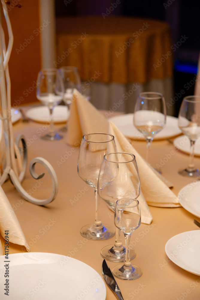 Elegant table setting for a festive dinner in the restaurant Elegant table setting for a festive dinner in the restaurant