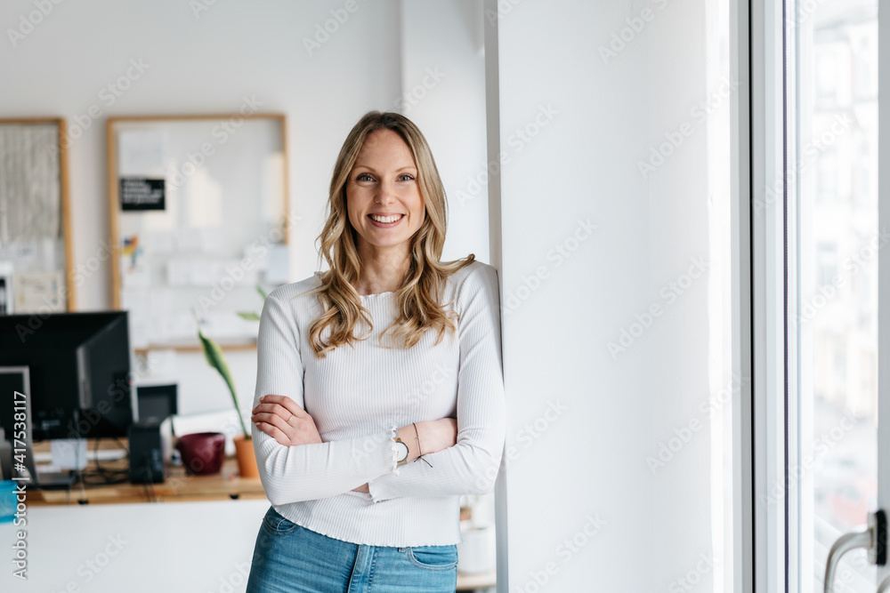 Vivacious young business woman with a lovely warm friendly smile