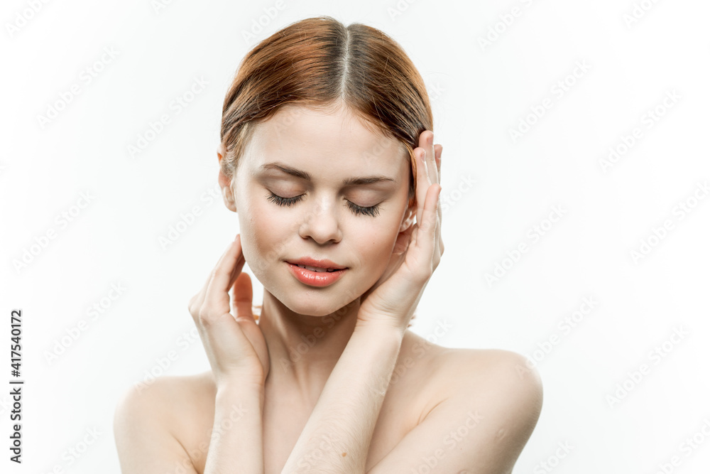 woman holding glamor face attractive look naked shoulders closed eyes woman holding glamor face attractive look naked shoulders closed eyes