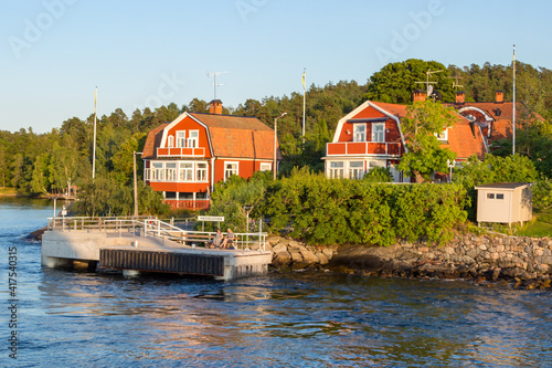 Colored scandinavian houses on Vaxholm island in Sweden photo