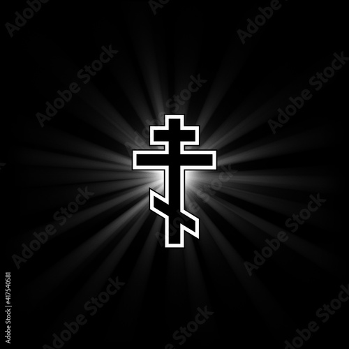 Orthodox cross on a black background with diverging rays of light.