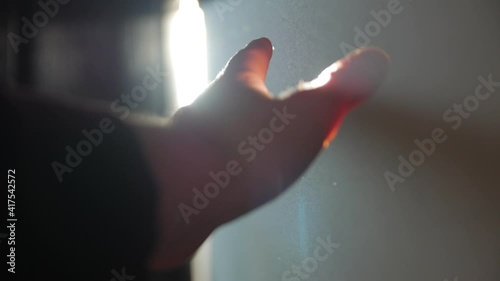 Sun ray man hand left POV dust indoors light