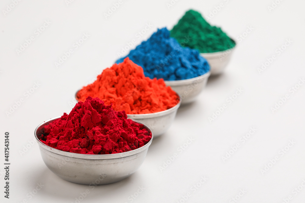 Indian festival Holi , Multi color's bowl on white background Indian festival Holi , Multi color's bowl on white background