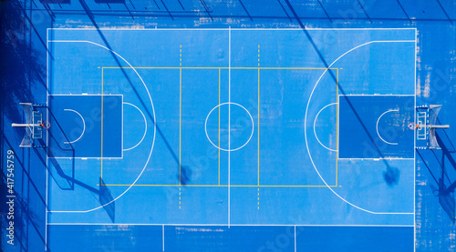 Multi purpose sports court, with Basketball, Soccer and Tennis marks.
