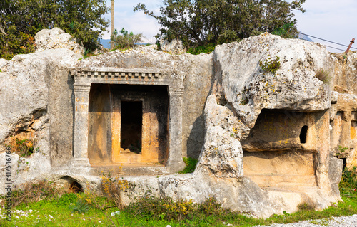 Remains of stone cut tombs in ancient Araxa city in Lycia, currently in Oren village near Fethiye, Turkey