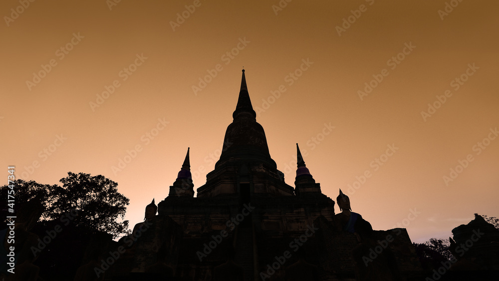 Silhouette of Pagoda and Buddha Status at Wat Yai Chaimongkol, Ayutthaya, Thailand