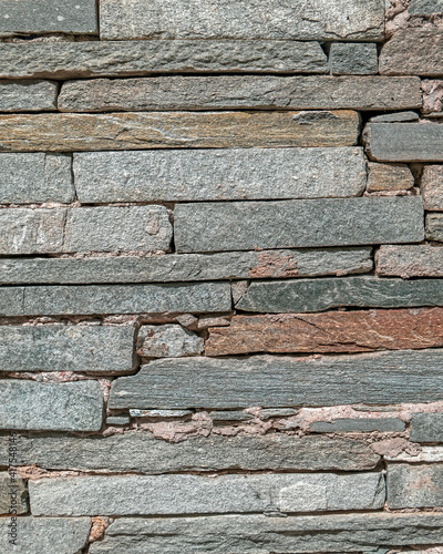 grey stone wall closeup, textured pattern natural background