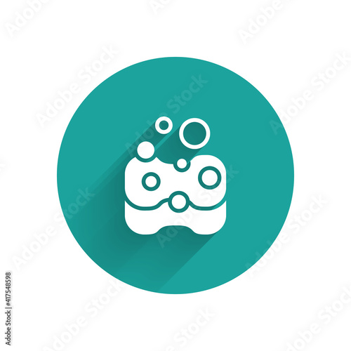 White Sponge icon isolated with long shadow. Wisp of bast for washing dishes. Cleaning service concept. Green circle button. Vector.