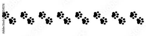 Cute animal. Foot dog seamless pattern. Footprint graphic. Pet outline. Repeated pattern trail cat. Paw prints for design service print. Foots border isolated on white background. Shape paw. Vector