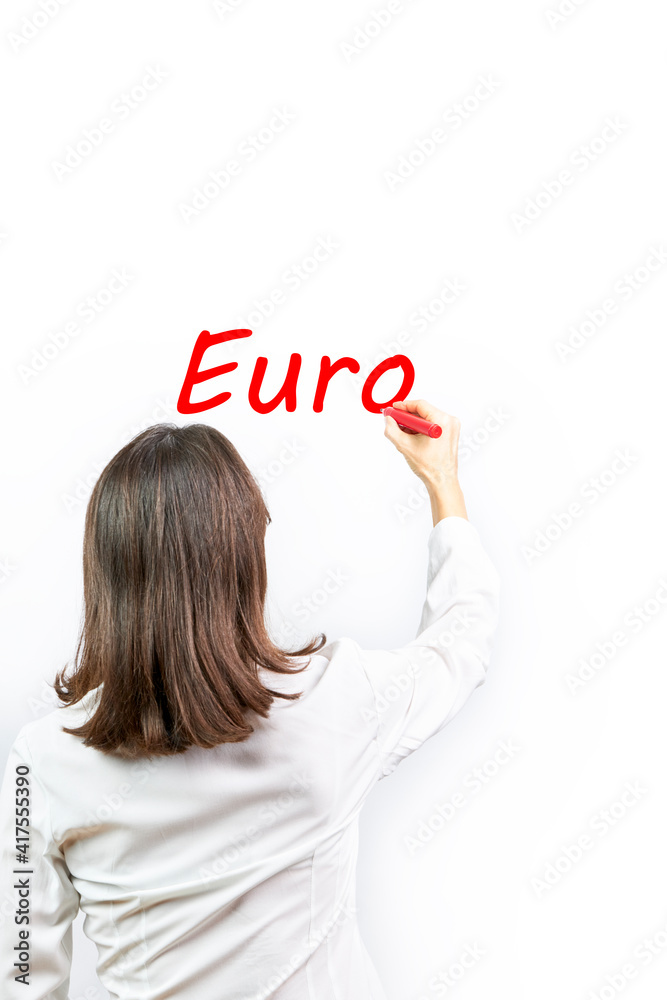 Executive woman writing the word Euro. Business concept Executive woman writing the word Euro. Business concept