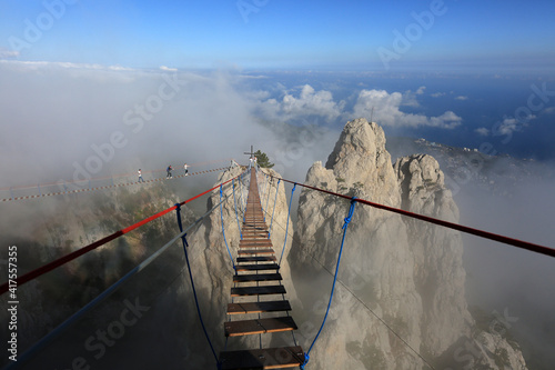 Go over the abyss along the suspension bridge to the rocks of Mount Ai-Petri. Travel across Crimea photo