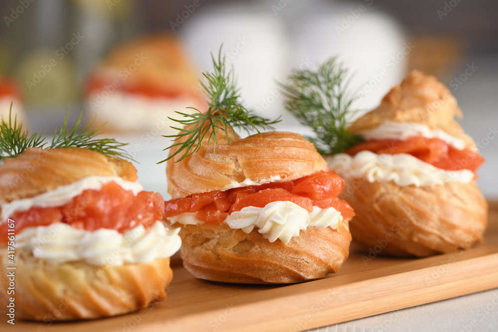 Profiteroles stuffed with cream cheese and salmon. Profiteroles stuffed with cream cheese and salmon.