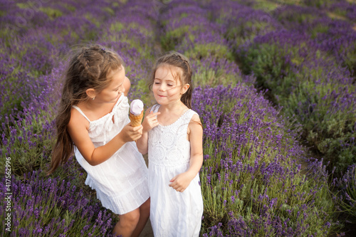 Cute sisters having fun in a lavender field
