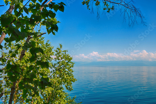 Fototapeta Naklejka Na Ścianę i Meble -  Beautiful natural summer landscape. Mountains, sky, water. Lake Baikal.