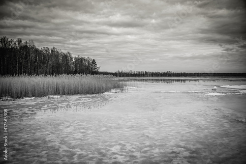 Frozen Lake in February in Latvia with Cloudscape