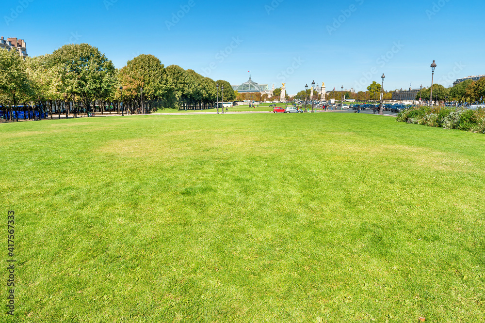 Esplanade with green lawn near Les Invalides Palace in Paris, France Esplanade with green lawn near Les Invalides Palace in Paris, France