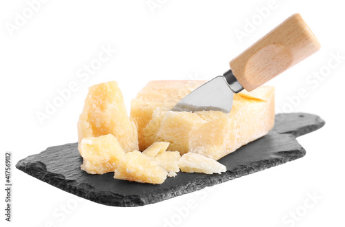 Parmesan cheese with knife and slate plate on white background