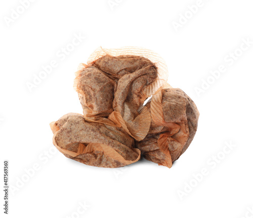 Many used tea bags on white background