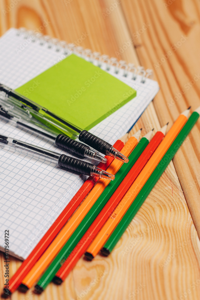 notepads pencils stationery school items work desk top view notepads pencils stationery school items work desk top view