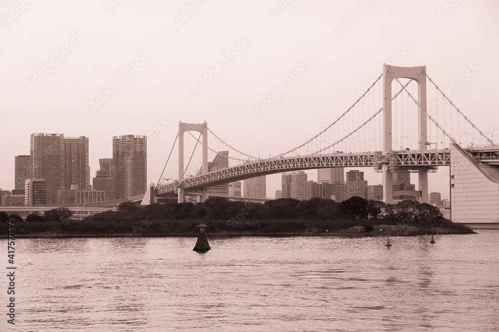 Naklejka premium Rainbow Bridge in Tokyo, Japan - sepia Tokyo