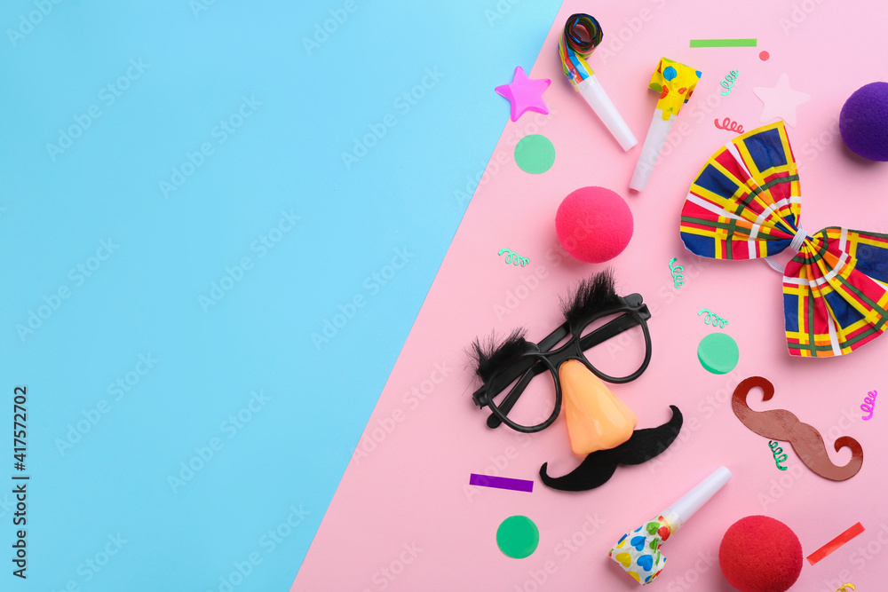 Obraz premium Flat lay composition with clown's accessories on color background. Space for text