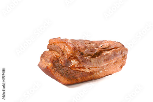 Pork fat.A piece of homemade boiled brisket with meat layers is isolated on a white background.
