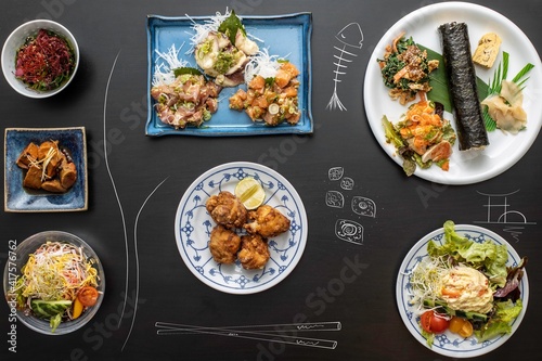 Japanese food over the table with illustrations of Japan food