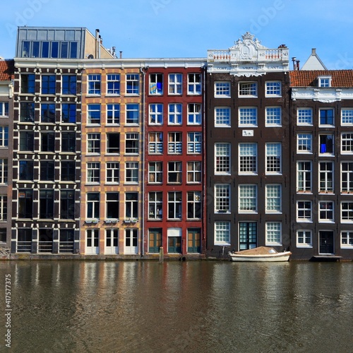 Amsterdam Damrak Canal. Netherlands architecture. Amsterdam landmarks.