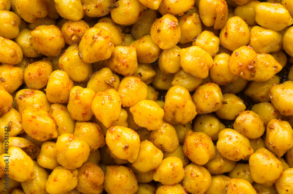 Cooking chickpeas with spices in a pan, close-up Cooking chickpeas with spices in a pan, close-up