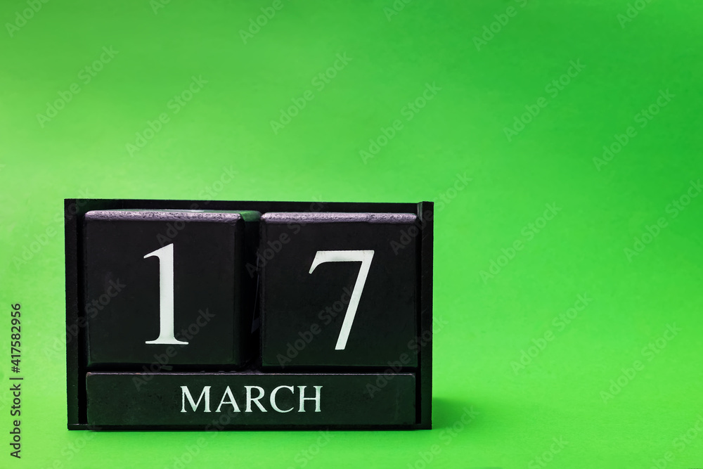 Block calendar for March 17 St Patrick's Day on green background Block calendar for March 17 St Patrick's Day on green background