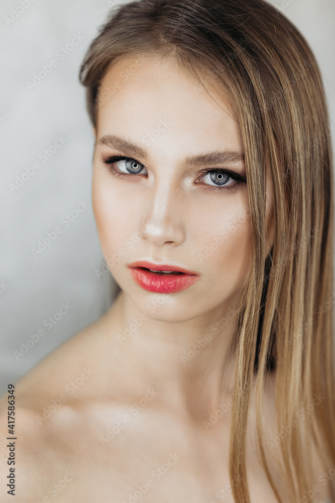 Portrait of a beautiful model, beauty fashion portrait of a young girl, isolated on a light background