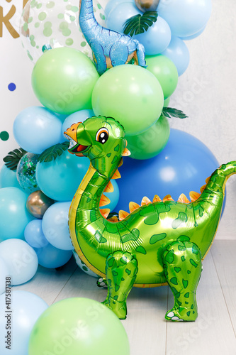 Birthday decorations - gifts, toys, balloons, garland and number for little baby party on a white wall background. © SDammer