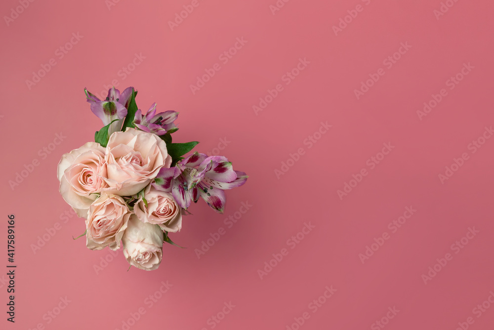 a bouquet of beautiful flowers on a pink background copy the space. the concept of spring, holiday and beauty